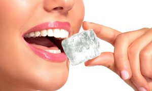 Smile biting into an ice cube